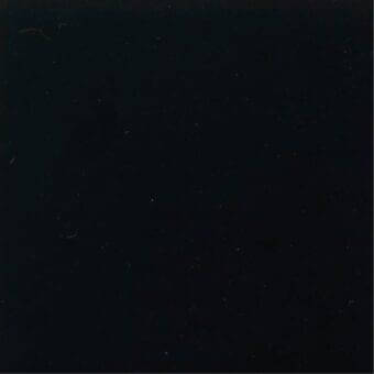 Black matte fabric texture, close-up view displaying a smooth, uniform surface with subtle tonal variations and minor imperfections.